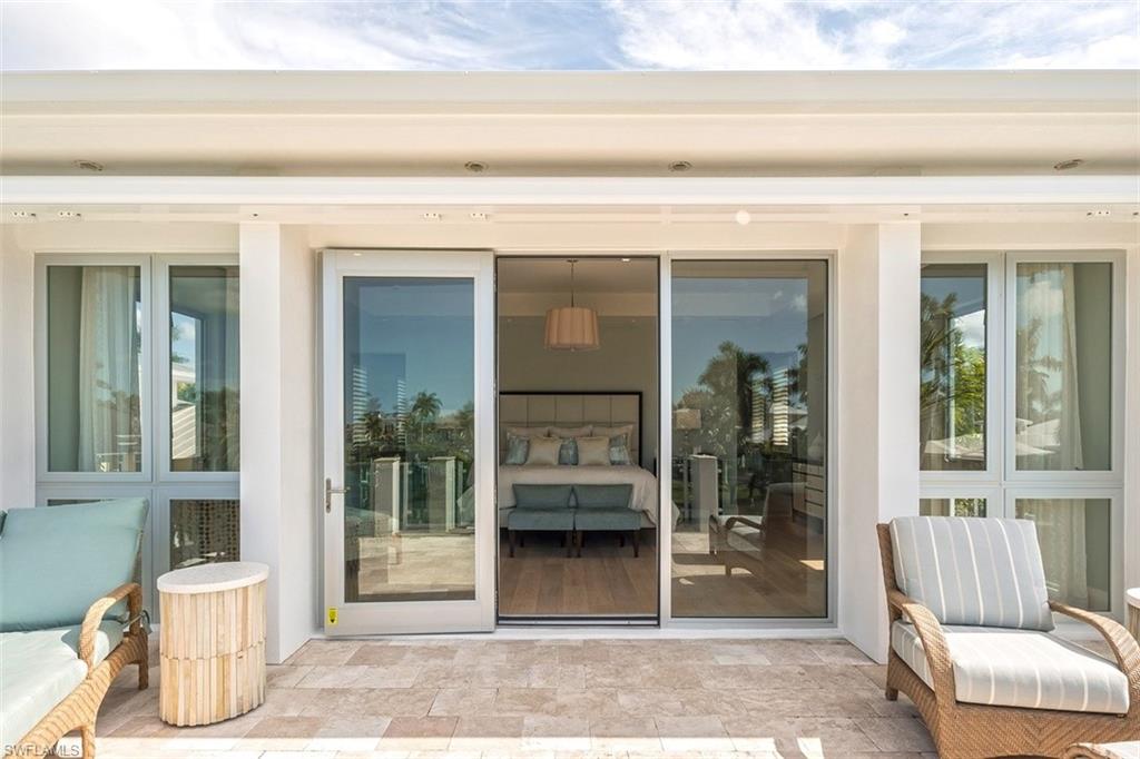2290 Tarpon Road Naples, FL 34102 - Photo 19 of 35 a view of a entryway door front of house