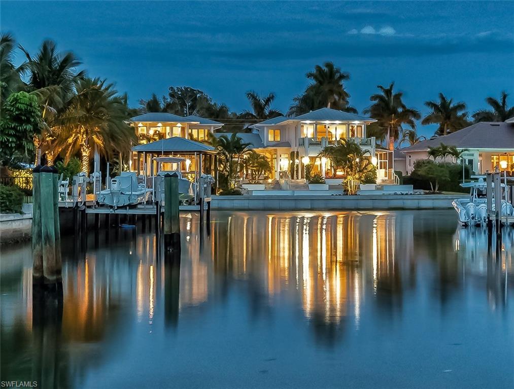 2290 Tarpon Road Naples, FL 34102 - Photo 2 of 35 a view of swimming pool from a lake view