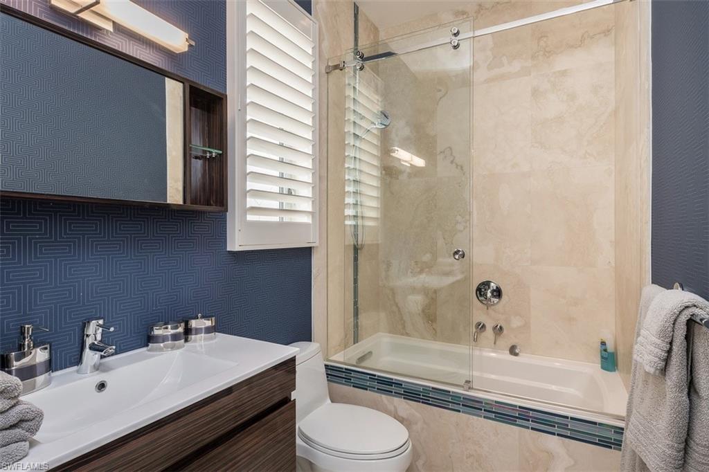 2290 Tarpon Road Naples, FL 34102 - Photo 26 of 35 a bathroom with a sink toilet and shower