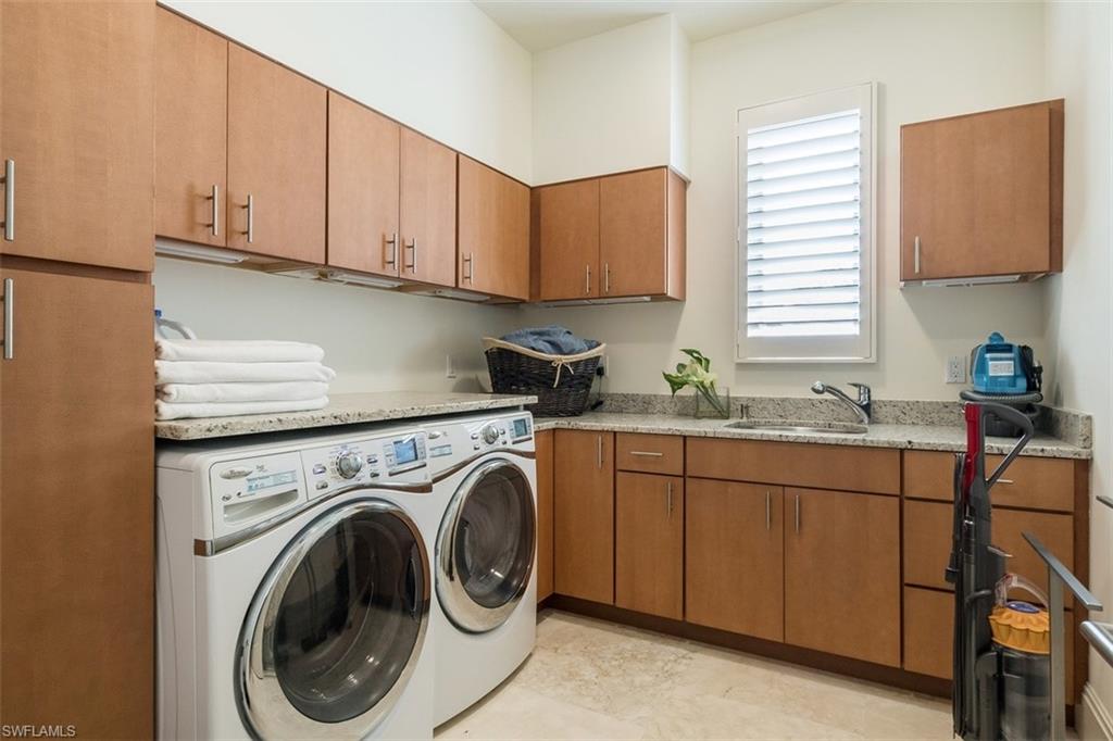 2290 Tarpon Road Naples, FL 34102 - Photo 27 of 35 a kitchen with sink cabinets and window