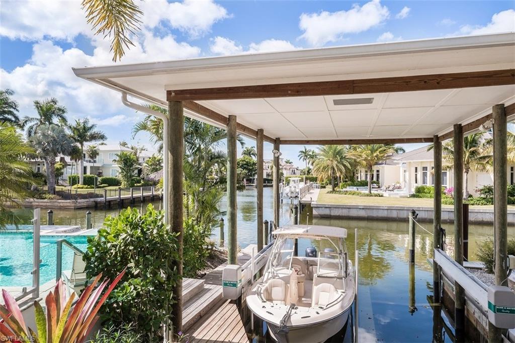 2290 Tarpon Road Naples, FL 34102 - Photo 29 of 35 a view of a dining room with furniture window and wooden floor