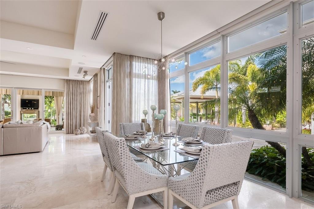 2290 Tarpon Road Naples, FL 34102 - Photo 7 of 35 a view of a dining room with furniture window and outside view