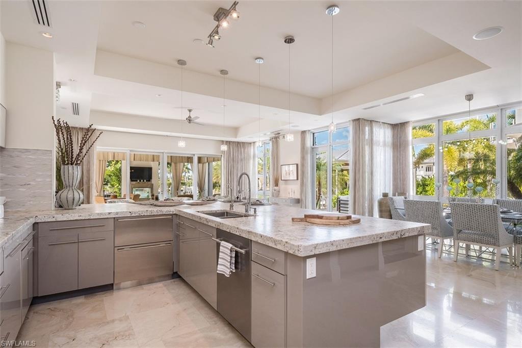 2290 Tarpon Road Naples, FL 34102 - Photo 10 of 35 a kitchen with sink and window