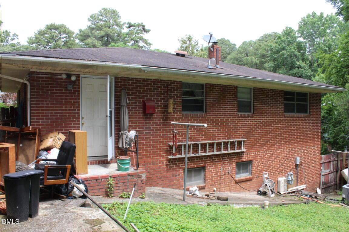 5109 Kaplan Drive Raleigh, NC 27606 - Photo 12 of 13 a view of a house with a yard