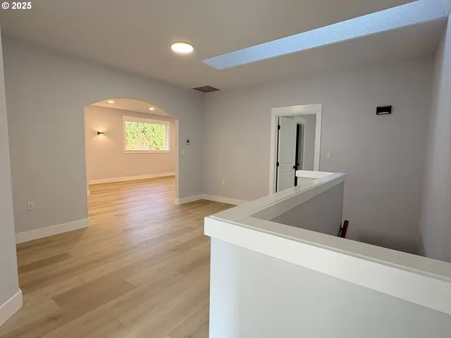 a bedroom with a bed and a mirror