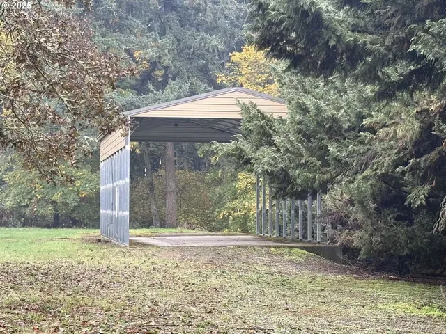 a backyard of a house with large trees