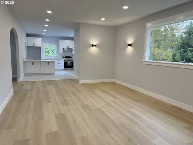 an empty room with windows and entrance