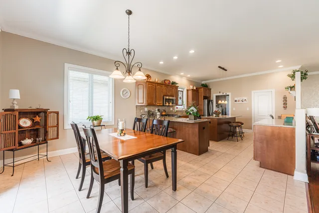 a dining room with furniture and window
