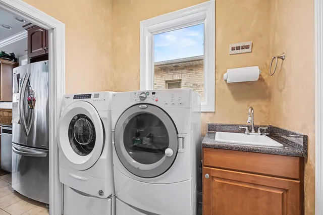 a utility room with dryer and washer