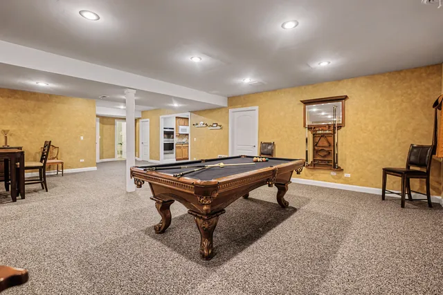 a room with furniture pool table and a table
