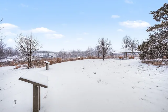 a view of covered with snow in front of house