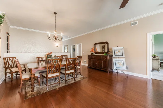 a view of a livingroom with furniture and wooden floor