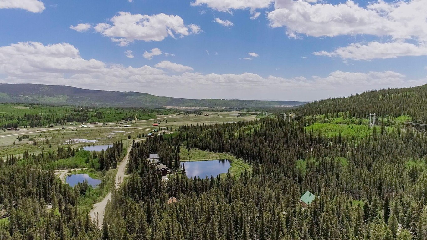503 Golden Hills Road Alma, CO 80420 - Photo 19 of 36 a view of a lake with a mountain in the background