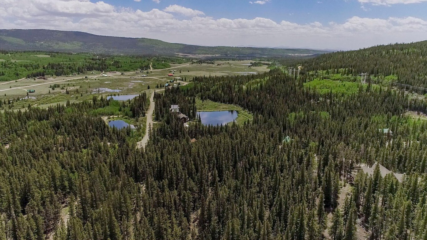 503 Golden Hills Road Alma, CO 80420 - Photo 20 of 36 a view of a city with lush green forest