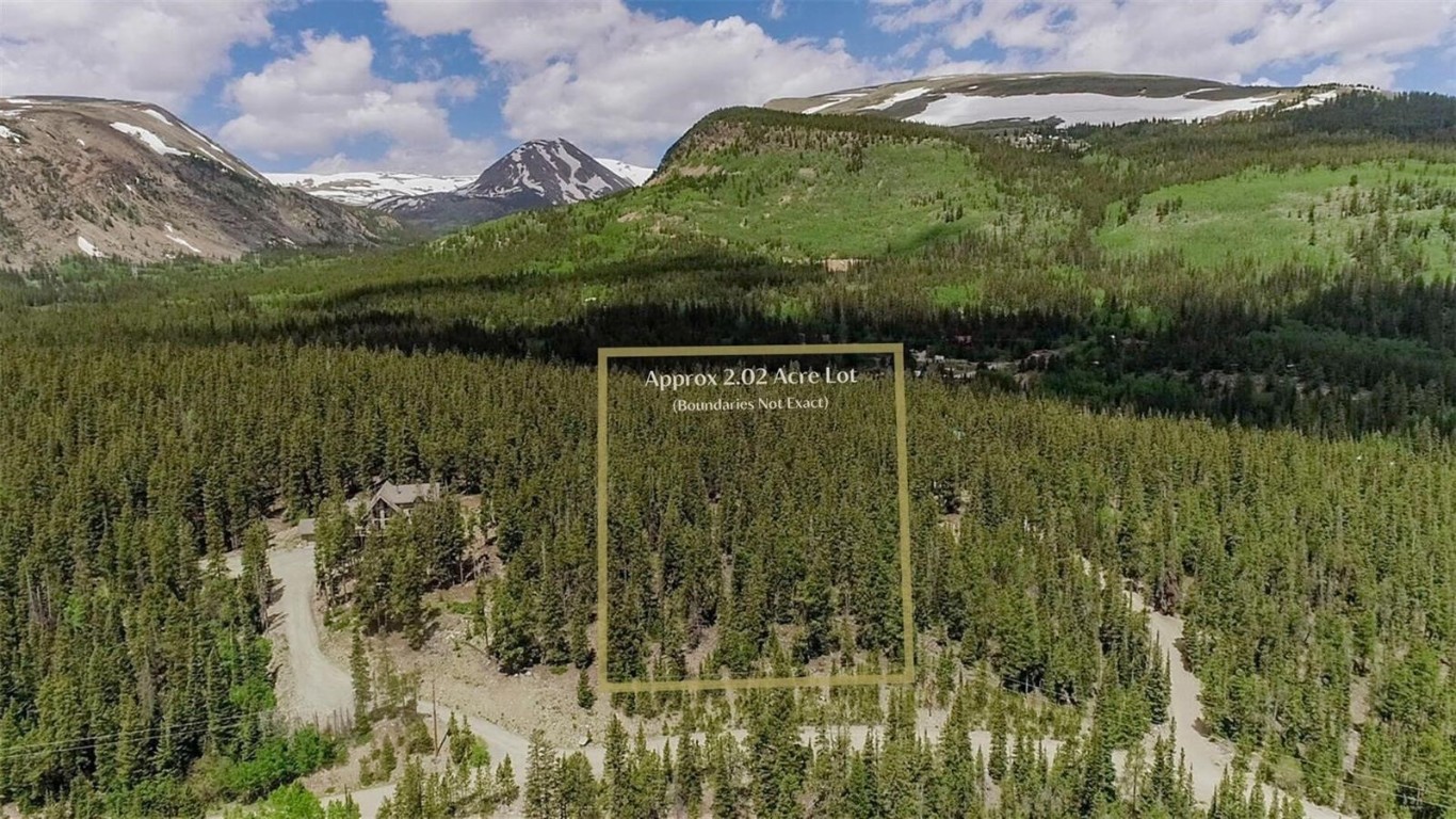 503 Golden Hills Road Alma, CO 80420 - Photo 3 of 36 a view of a lake in middle of the forest