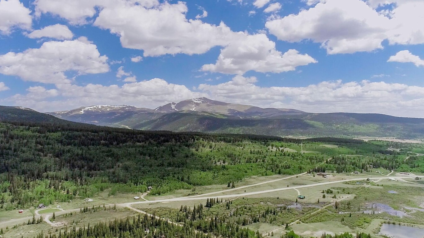 503 Golden Hills Road Alma, CO 80420 - Photo 36 of 36 a view of a lush green hillside and a houses