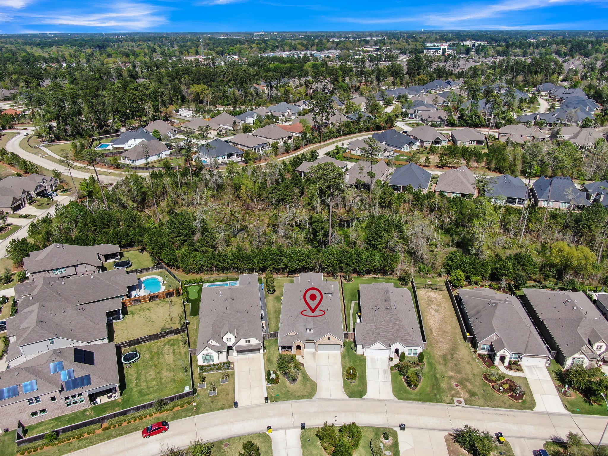 334 Torrey Bloom Loop Conroe, TX 77304 - Photo 42 of 47 Aerial view highlighting the home’s location within the neighborhood, showcasing nearby streets, surrounding homes, and the community setting.