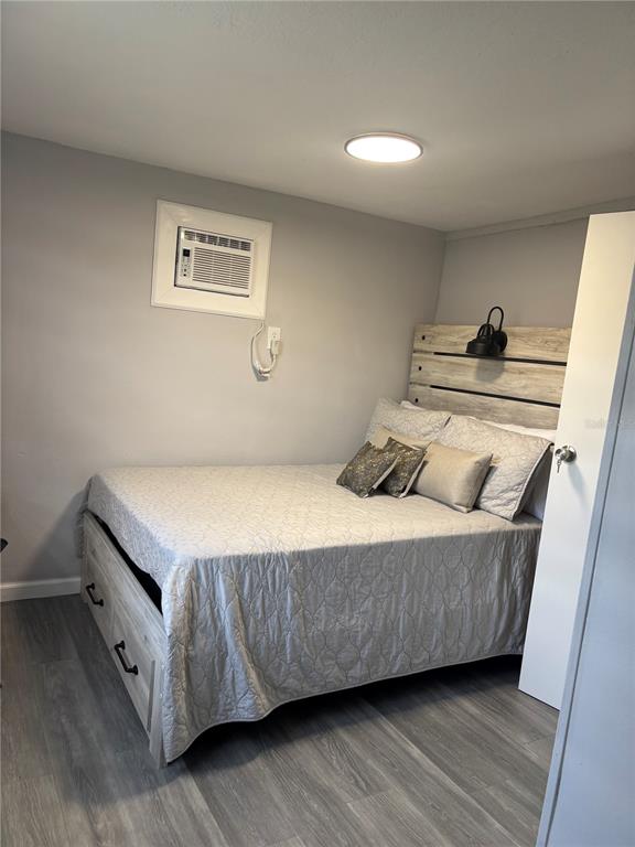 6141 Southwest 57th Court Ocala, FL 34474 - Photo 7 of 8 a living room with furniture and a wooden floor