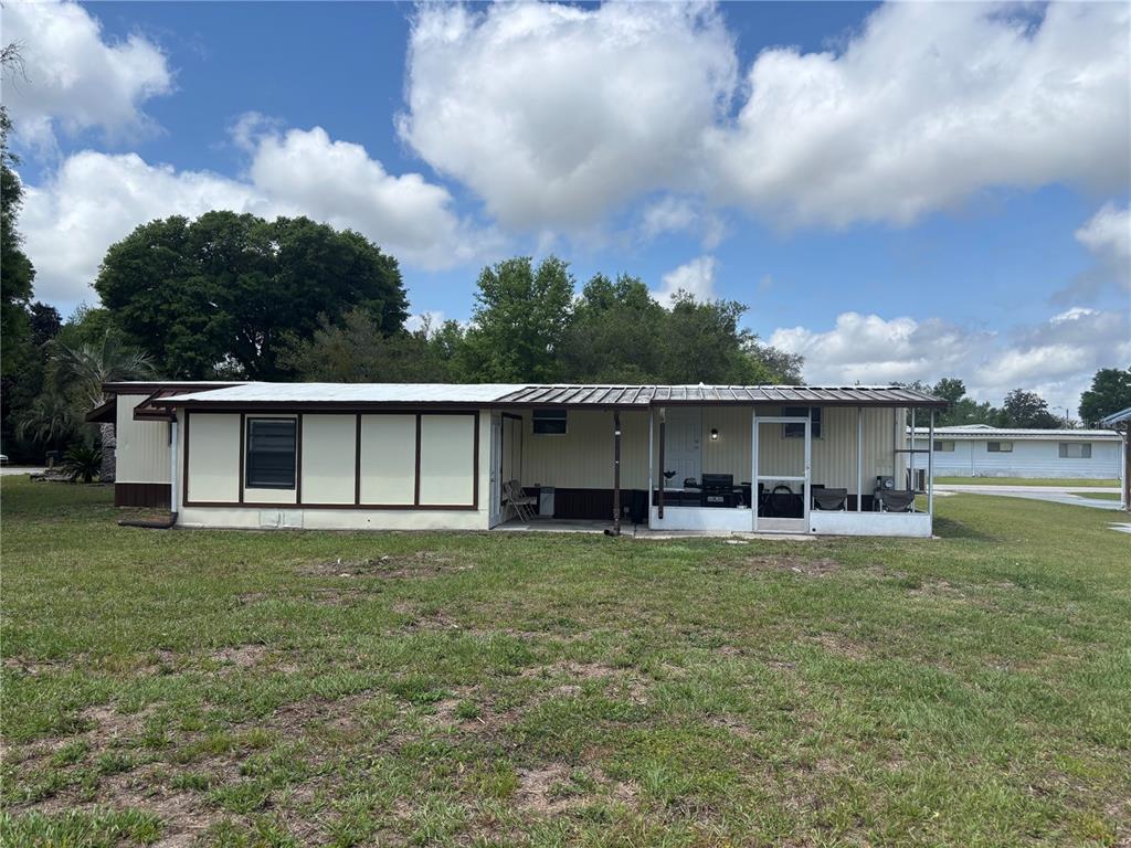 6141 Southwest 57th Court Ocala, FL 34474 - Photo 8 of 8 a view of a house with a yard