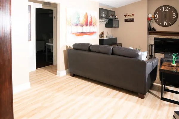 a view of a livingroom with furniture and wooden floor