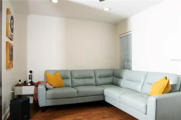 a kitchen with stainless steel appliances a stove a sink a microwave a refrigerator and cabinets