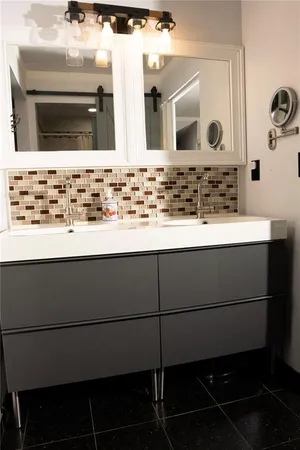 a white toilet sitting next to a shower curtain
