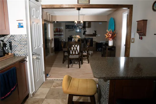 a kitchen with stainless steel appliances granite countertop a sink a stove and a refrigerator