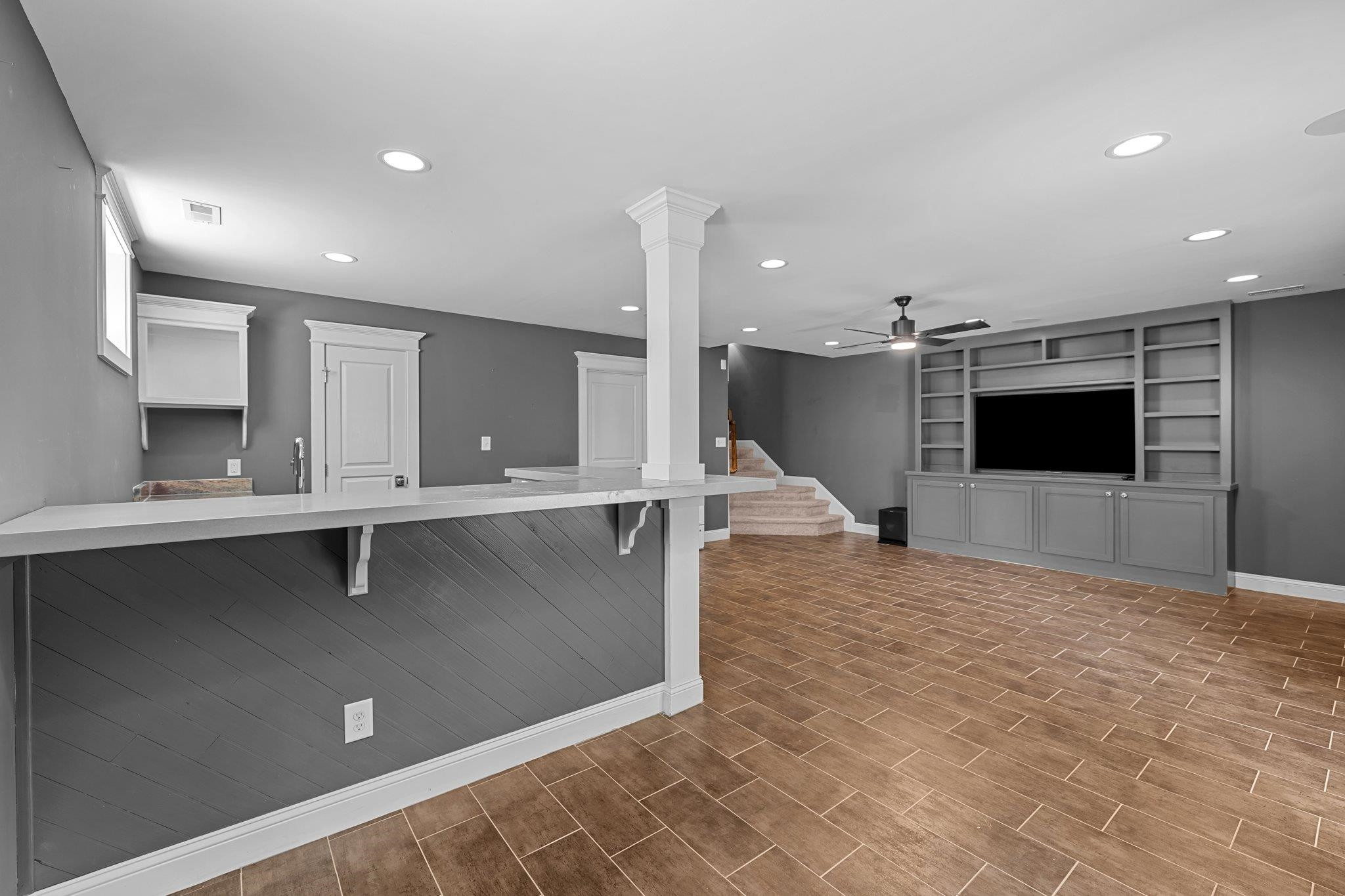 2116 Cowper Drive Raleigh, NC 27608 - Photo 56 of 65 The finished basement is a masterfully appointed retreat, replete with a cornucopia of creature comforts and all the tools for ultimate relaxation or recreation. Finished Basement Bonus Room