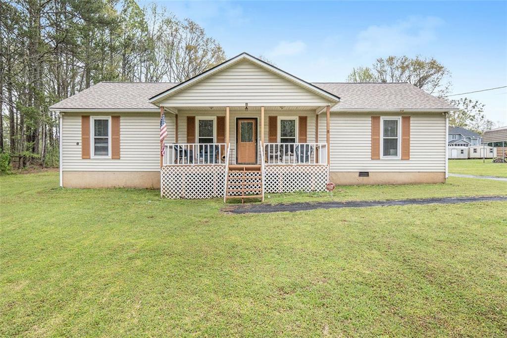 202 Hunters Lane Powder Springs, GA 30127 - Photo 1 of 1 front view of a house with a garden