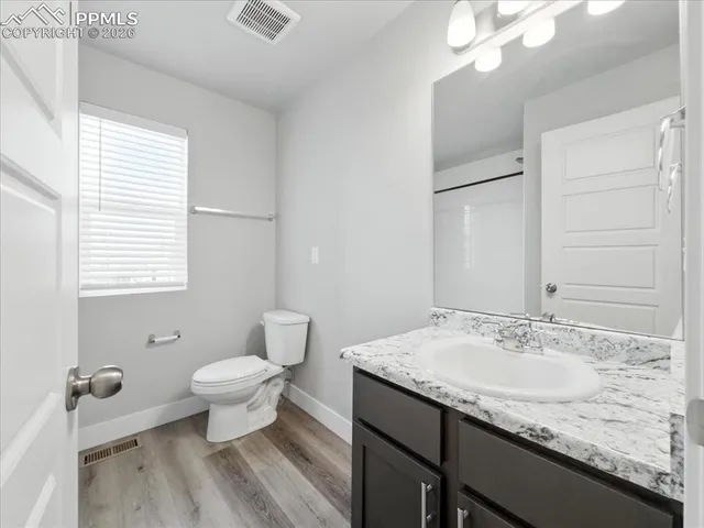 a bathroom with a shower and a bath tub