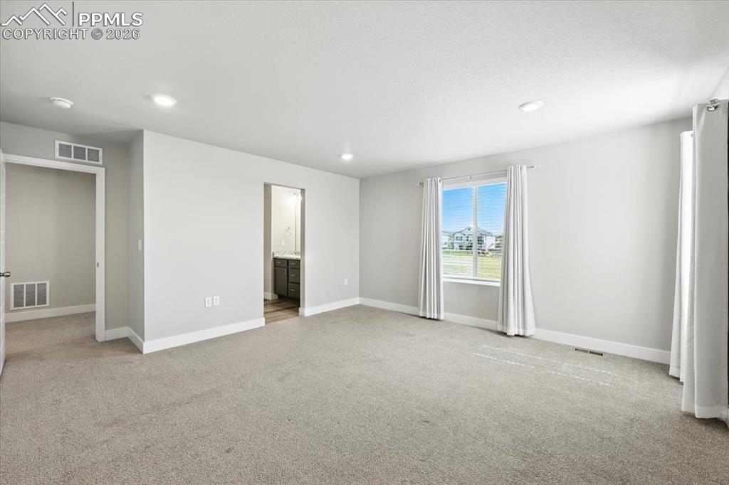 9891 Hidden Ranch Court Peyton, CO 80831 - Photo 21 of 44 a view of an empty room with a window