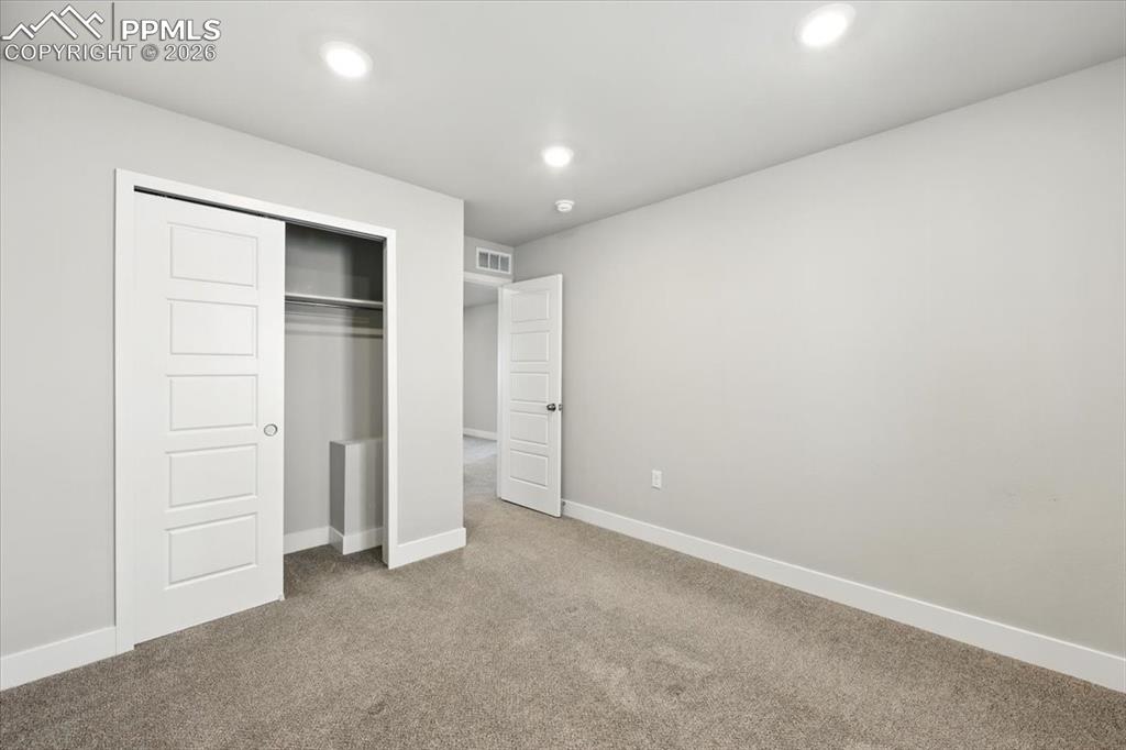 9891 Hidden Ranch Court Peyton, CO 80831 - Photo 27 of 44 an empty room with closet area