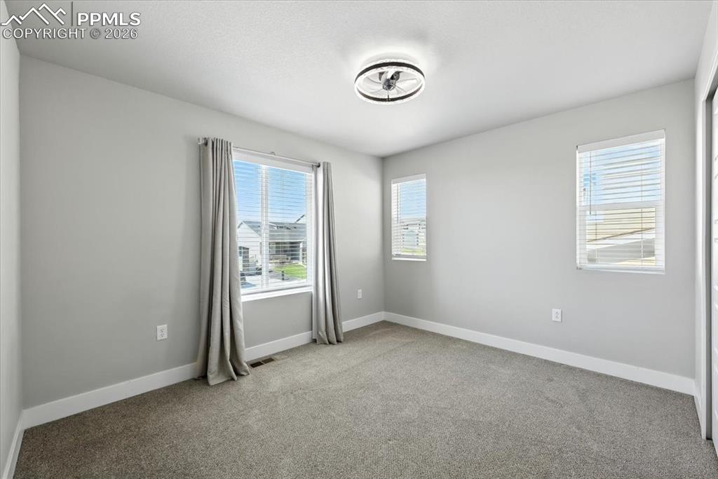 9891 Hidden Ranch Court Peyton, CO 80831 - Photo 28 of 44 a view of an empty room with a window