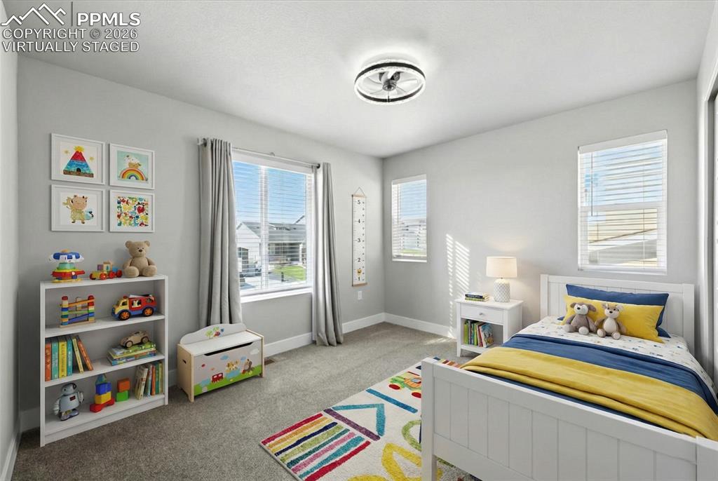 9891 Hidden Ranch Court Peyton, CO 80831 - Photo 29 of 44 a bedroom with bed and a window