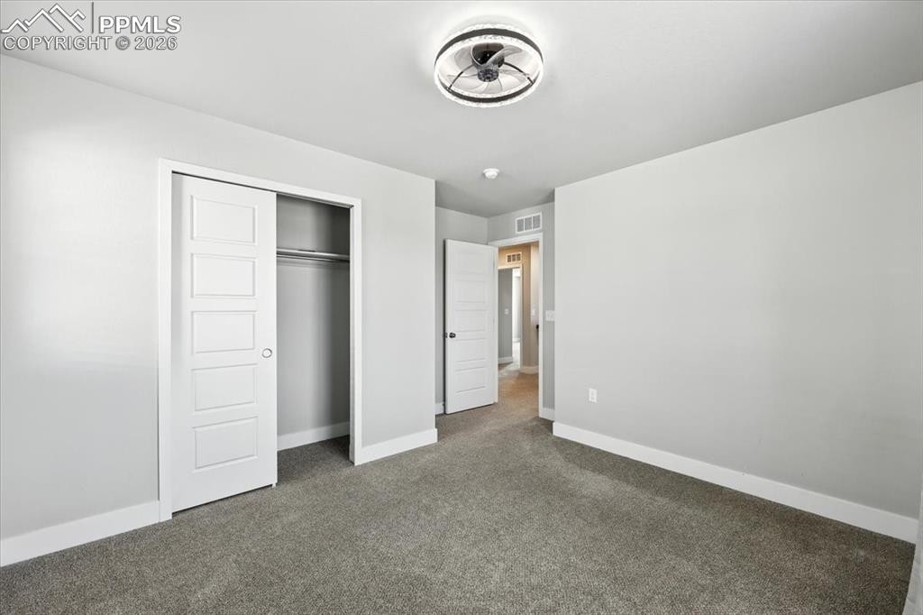 9891 Hidden Ranch Court Peyton, CO 80831 - Photo 30 of 44 an empty room with a door