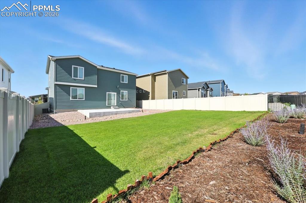 9891 Hidden Ranch Court Peyton, CO 80831 - Photo 38 of 44 a front view of a house with a yard