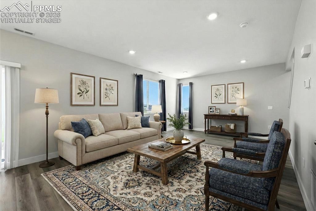 9891 Hidden Ranch Court Peyton, CO 80831 - Photo 8 of 44 a living room with furniture a rug and a window