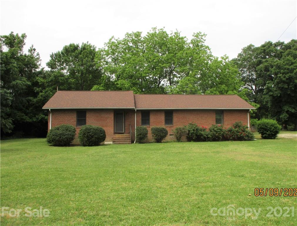 1287 Potter Road Lancaster, SC 29720 - Photo 1 of 25 a view of a house with a yard and garage