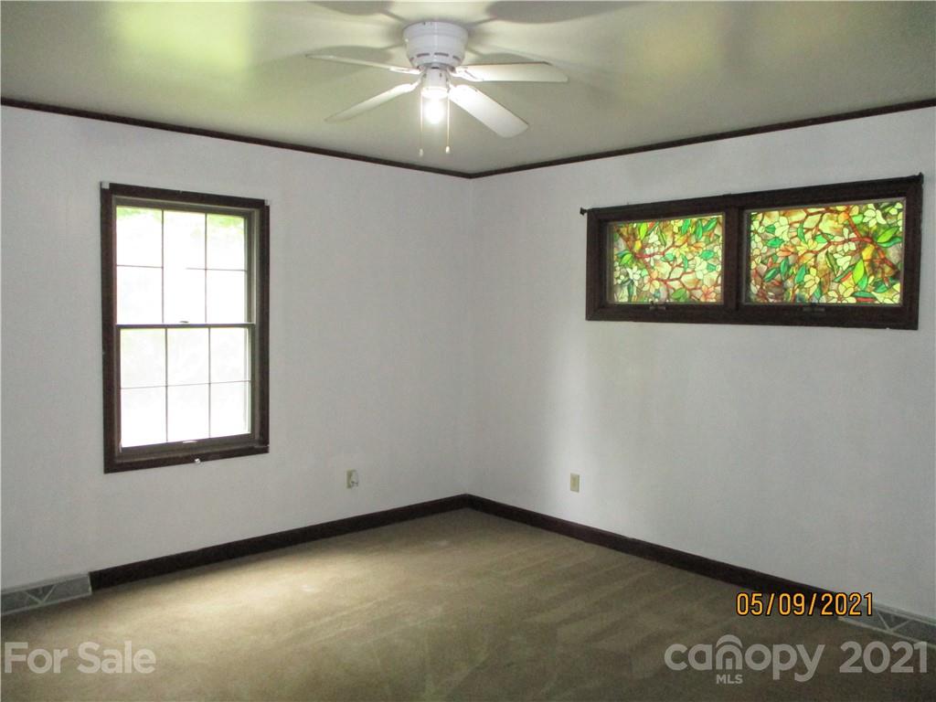 1287 Potter Road Lancaster, SC 29720 - Photo 13 of 25 an empty room with a window and a projector screen