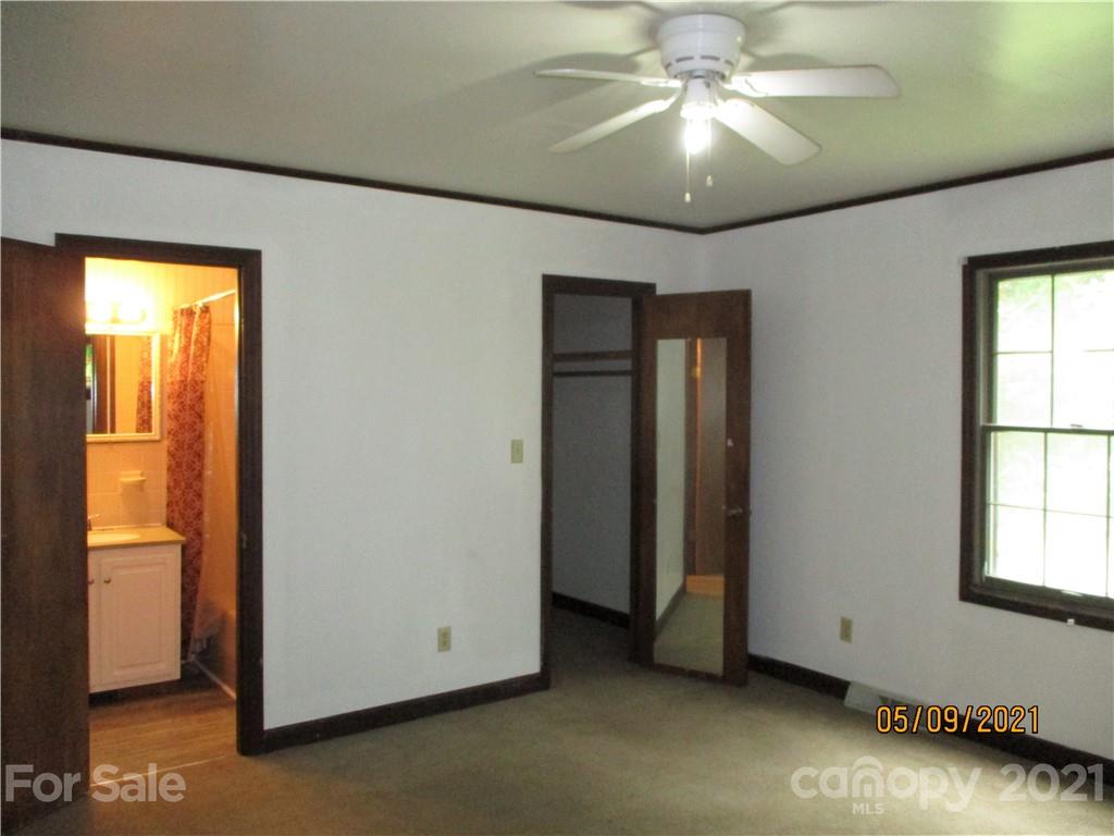 1287 Potter Road Lancaster, SC 29720 - Photo 14 of 25 a view of an empty room with window and chandelier fan