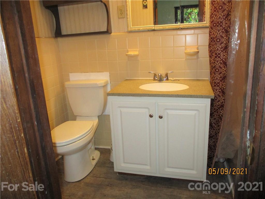 1287 Potter Road Lancaster, SC 29720 - Photo 16 of 25 a bathroom with a toilet sink and mirror