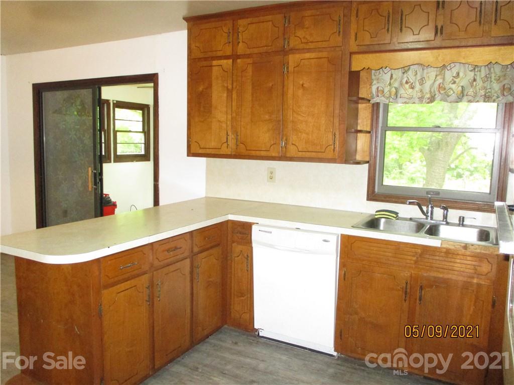 1287 Potter Road Lancaster, SC 29720 - Photo 7 of 25 a kitchen with granite countertop cabinets and window