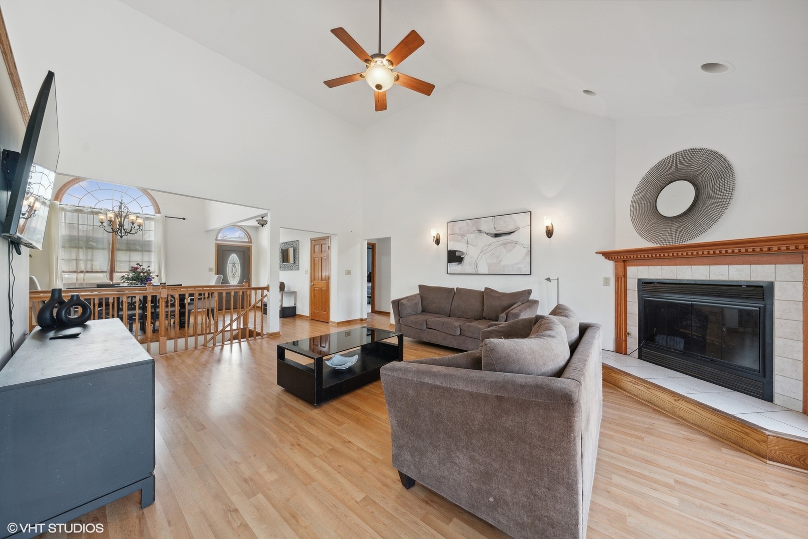 331 Coventry Lane Crete, IL 60417 - Photo 6 of 19 a living room with furniture a fireplace and a flat screen tv