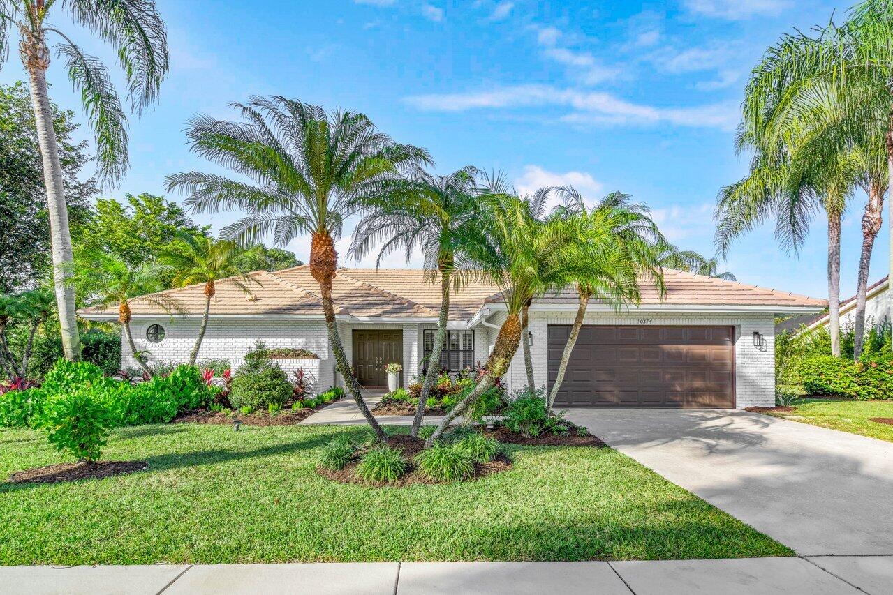10374 Canoe Brook Circle Boca Raton, FL 33498 - Photo 2 of 41 a front view of house with yard and green space