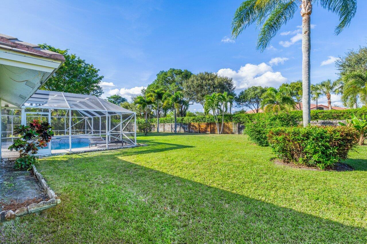 10374 Canoe Brook Circle Boca Raton, FL 33498 - Photo 30 of 41 a view of a house with a big yard
