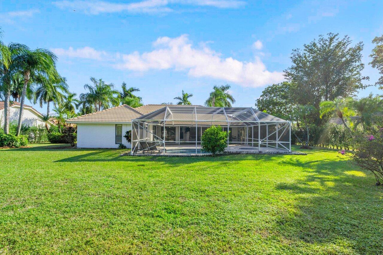 10374 Canoe Brook Circle Boca Raton, FL 33498 - Photo 32 of 41 a front view of house with yard and seating area