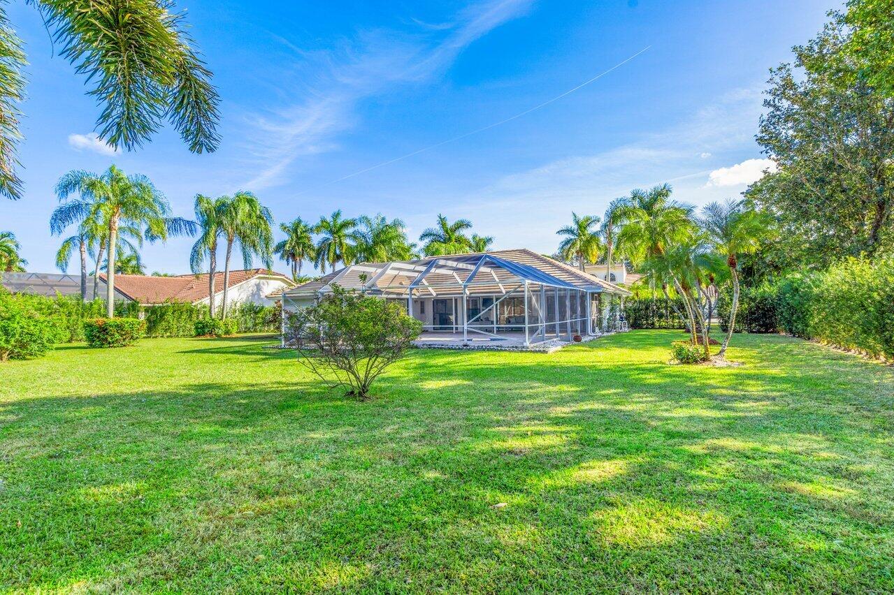 10374 Canoe Brook Circle Boca Raton, FL 33498 - Photo 33 of 41 a view of a house with a big yard