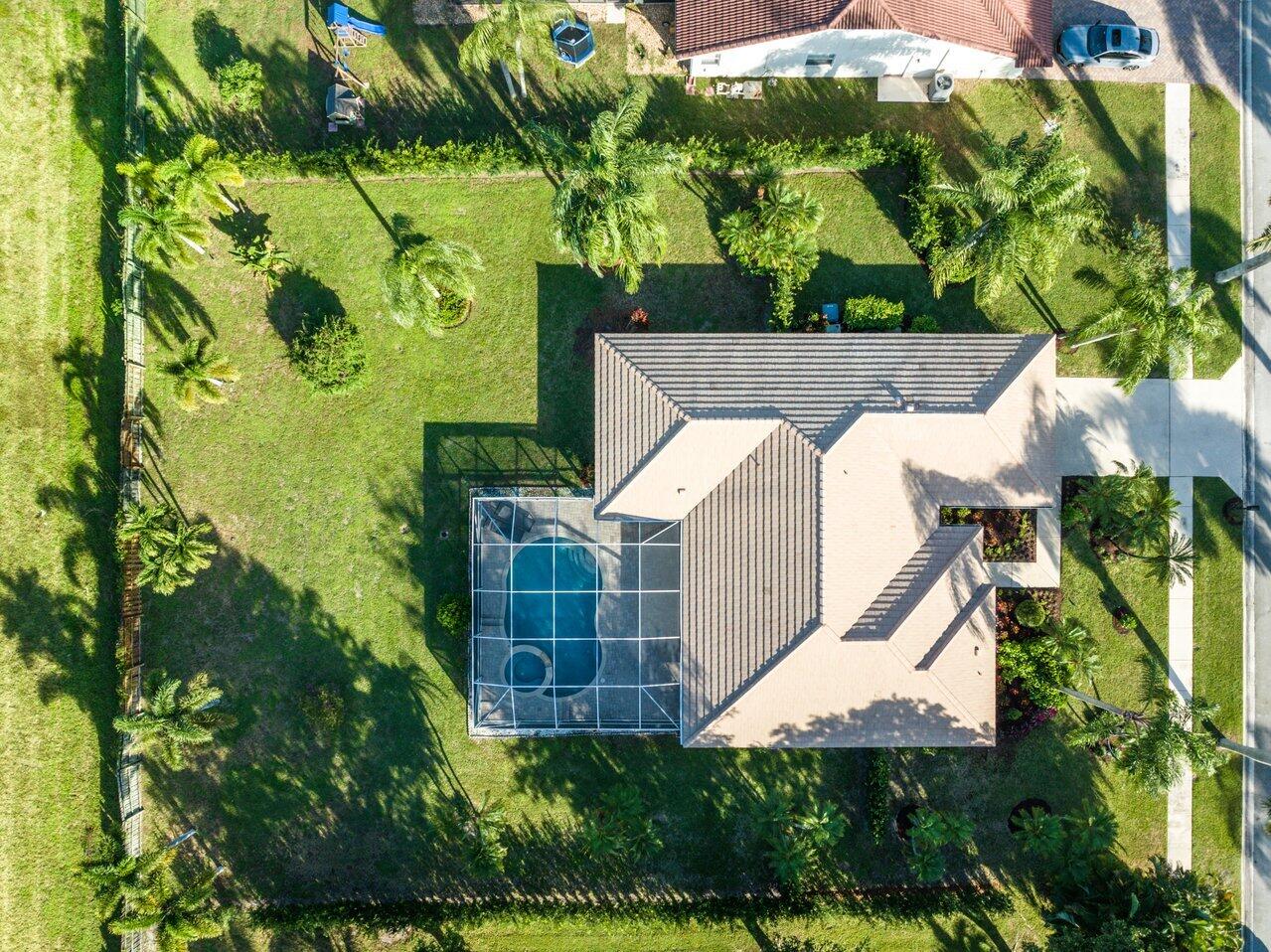 10374 Canoe Brook Circle Boca Raton, FL 33498 - Photo 35 of 41 a view of a yard with plants