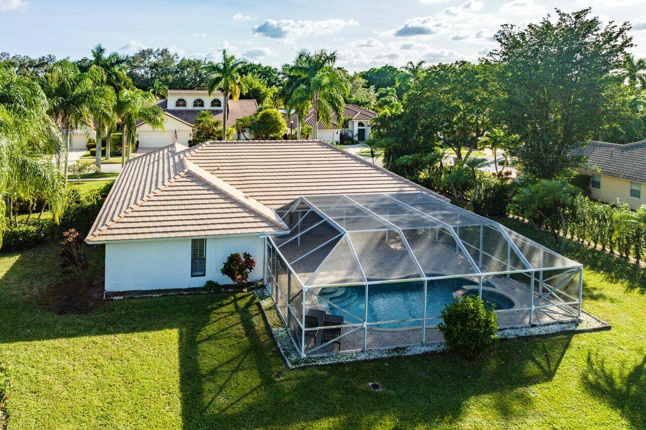 10374 Canoe Brook Circle Boca Raton, FL 33498 - Photo 36 of 41 an aerial view of a house with swimming pool and large trees