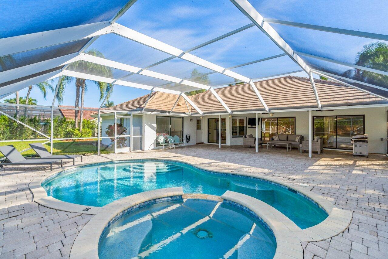 10374 Canoe Brook Circle Boca Raton, FL 33498 - Photo 4 of 41 a view of a house with swimming pool
